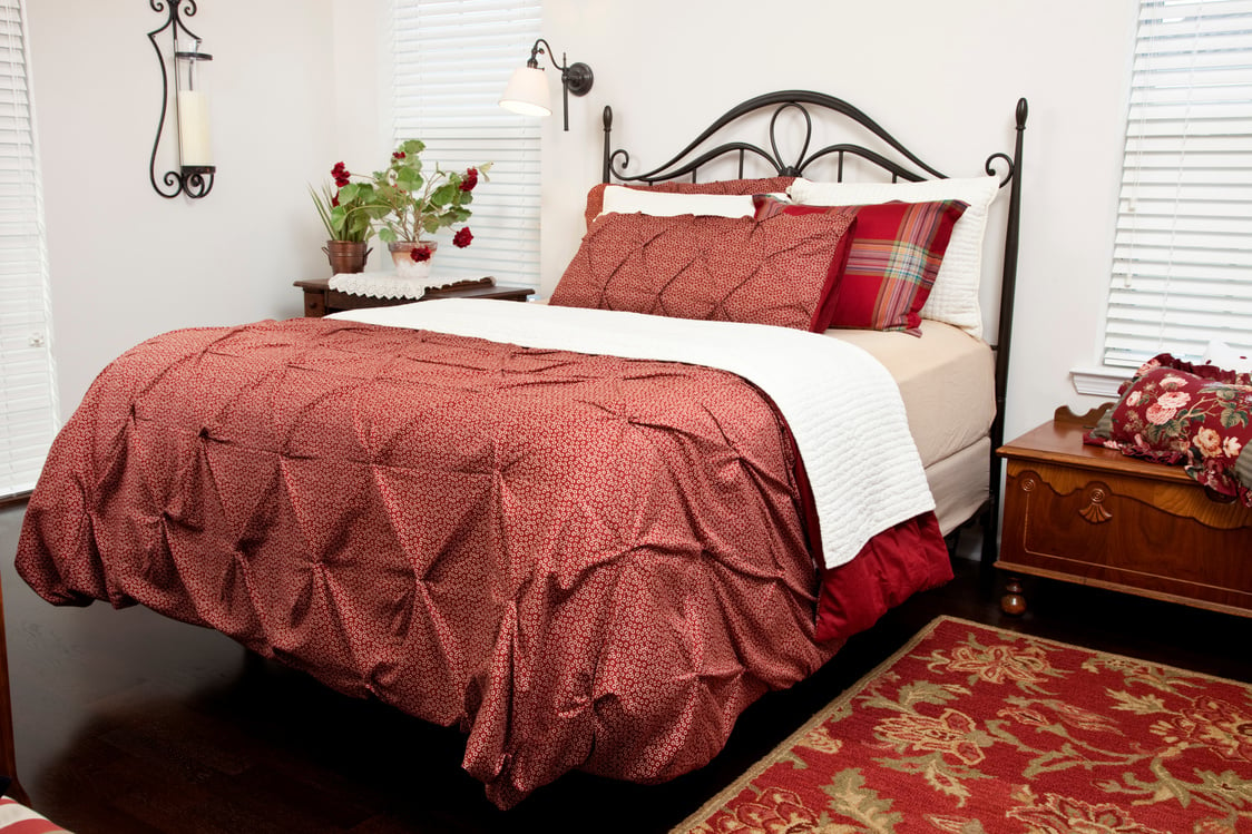 Bed room,  queen size bed, metal headboard in contemporary apartment