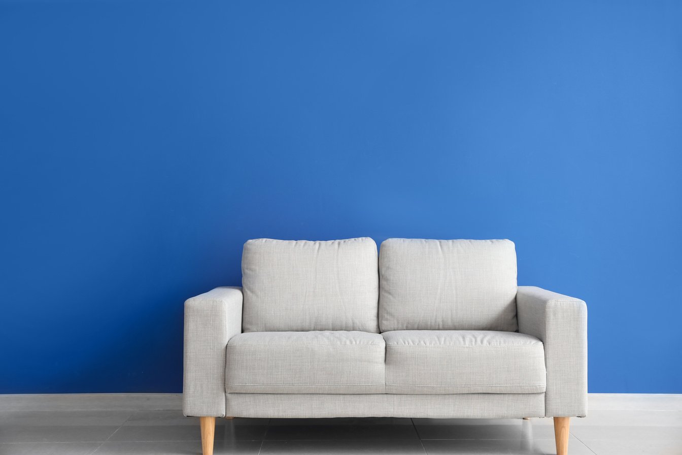 Modern Sofa Near Blue Wall