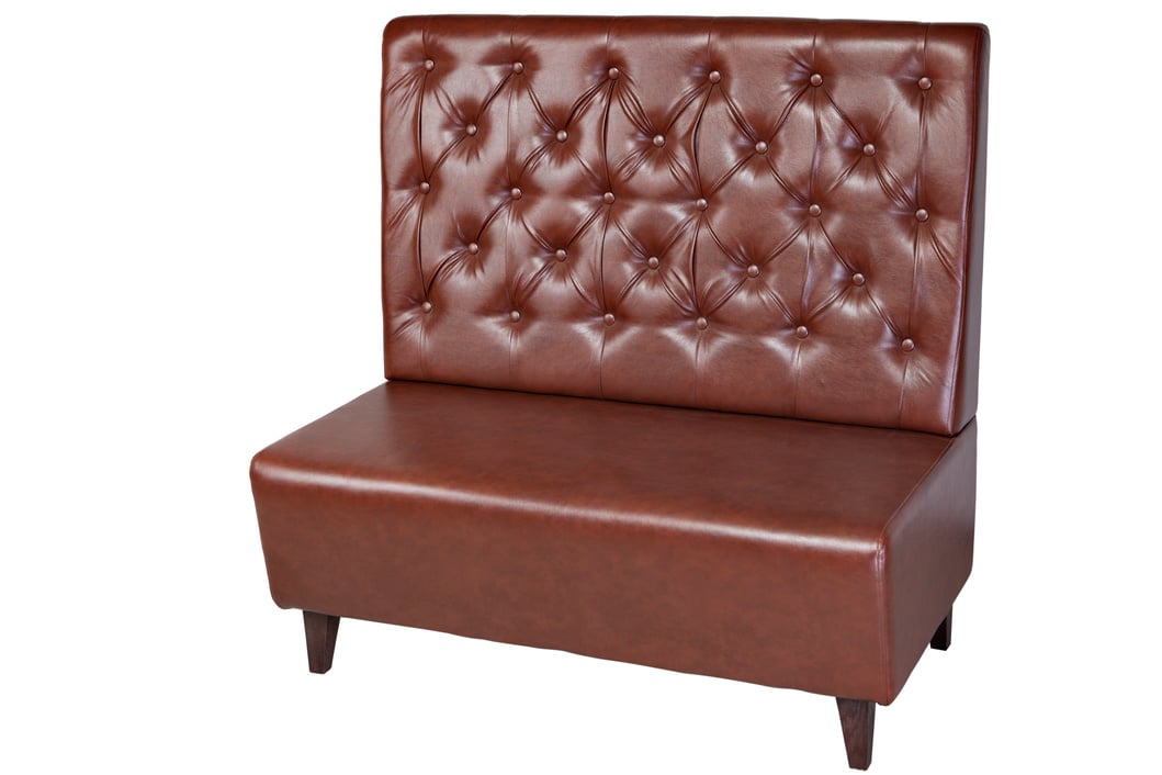 Two seater brown imitation leather office couch, isolated on white.